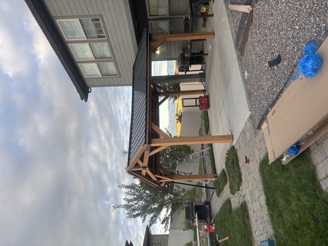 Handyman working on a Montana home at sunset